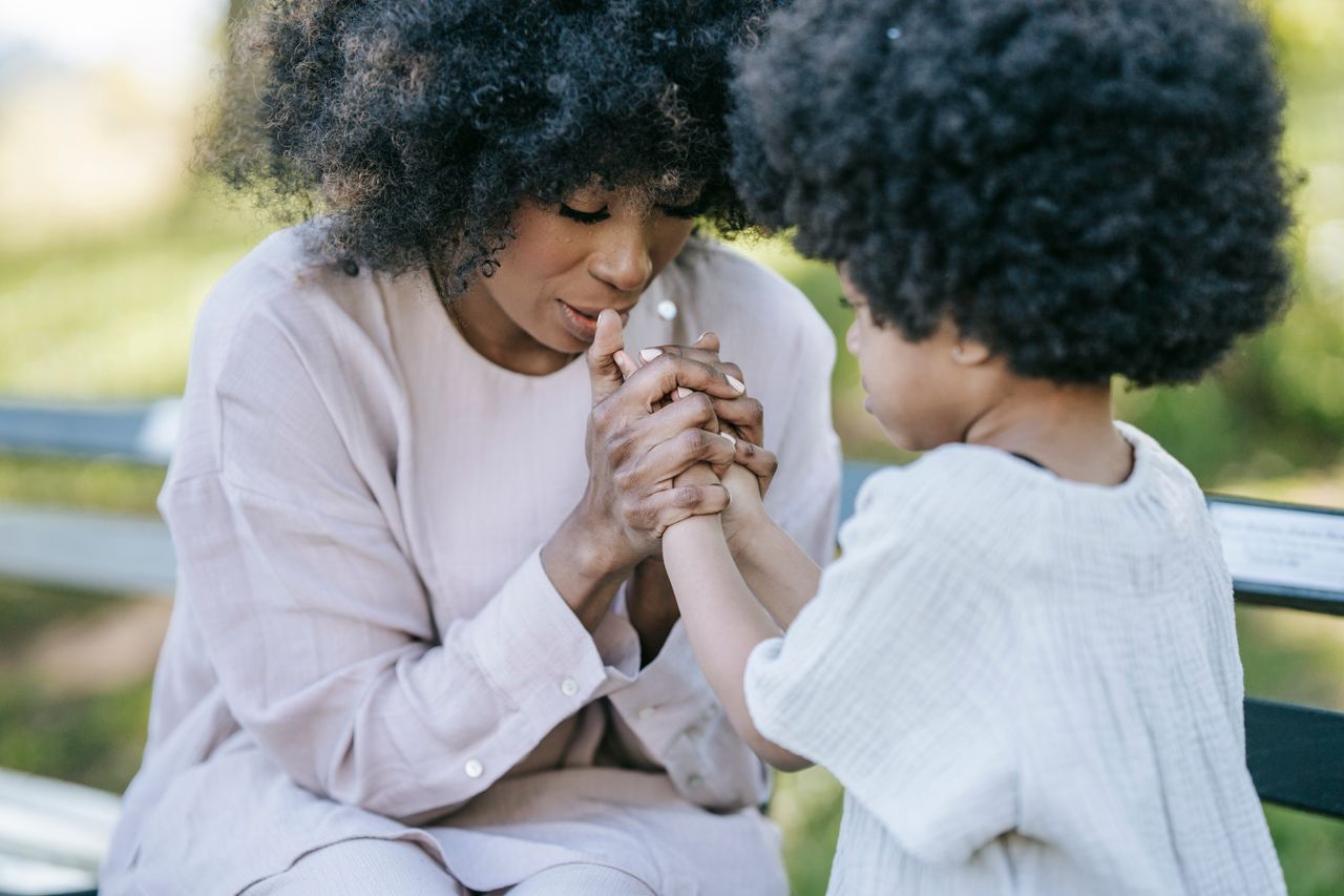 Mastering the First Impression: Your intriguing post title goes here A heartwarming moment between a mother and daughter holding hands outdoors.
